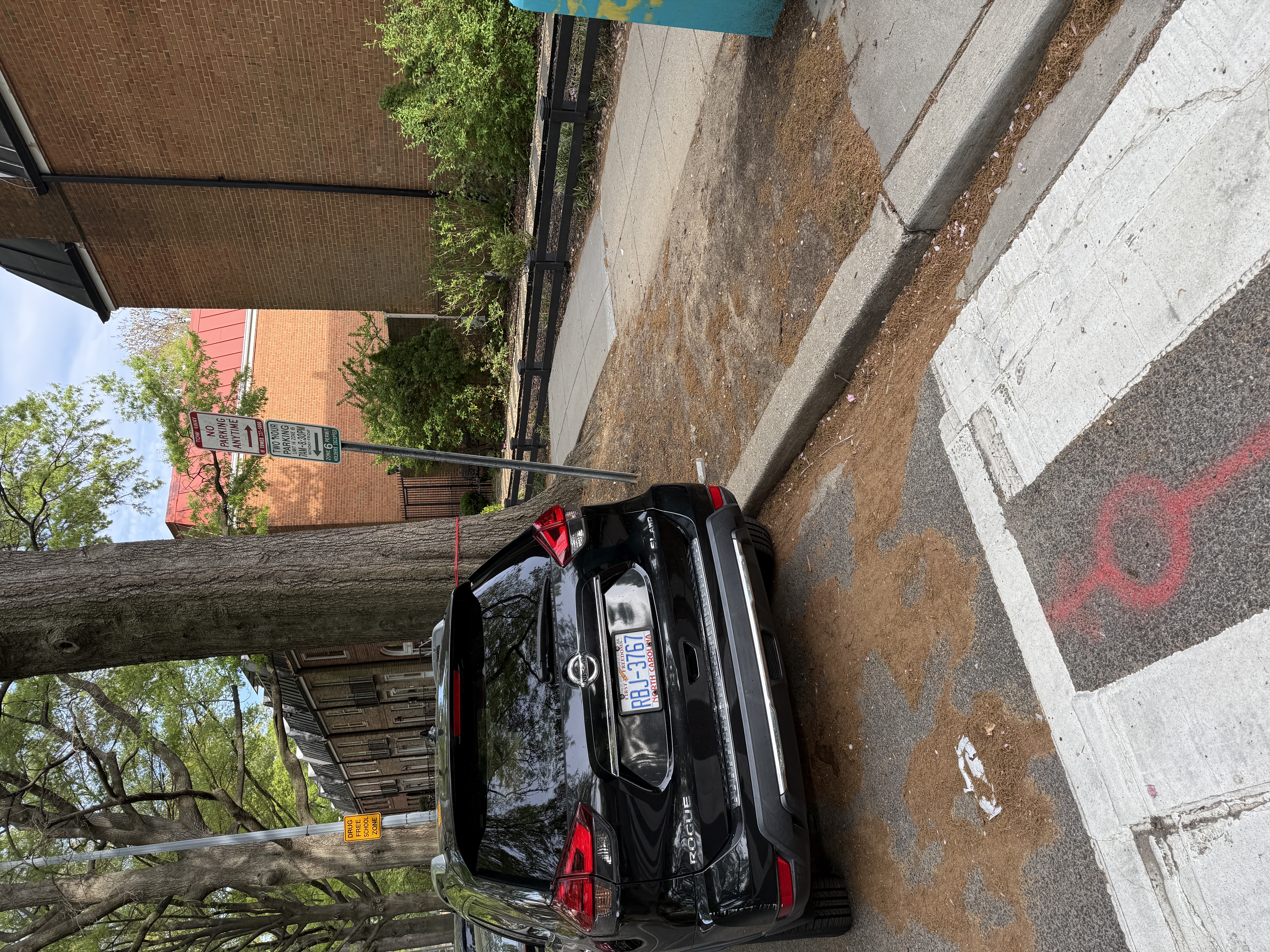 No Parking sign on G Street SW at 6th Street SW positioned too close to the crosswalk. A vehicle is parked exactly where DDOT's sign permits, well within the 40-foot intersection setback.